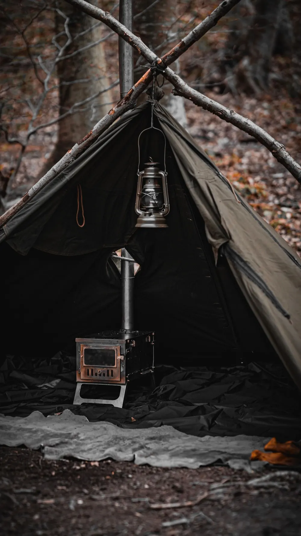 Wood stove inside a canvas tent