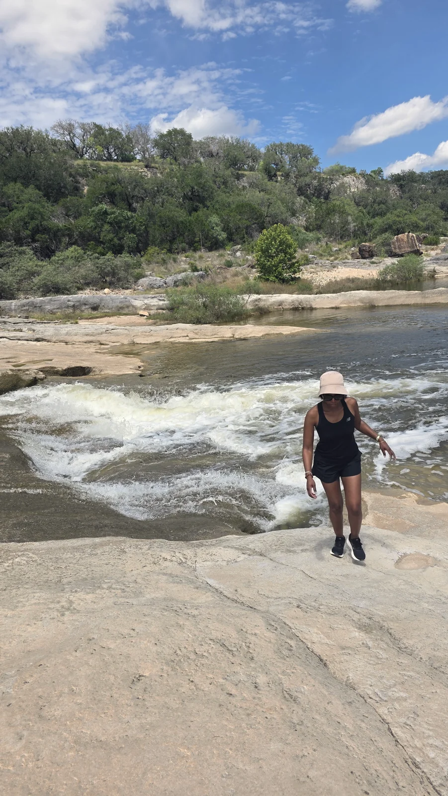Whitewater rapids rushing over rocks in the Texas Hill Country